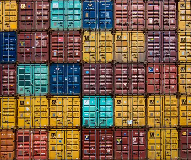 Wall of colourful stacked shipping containers