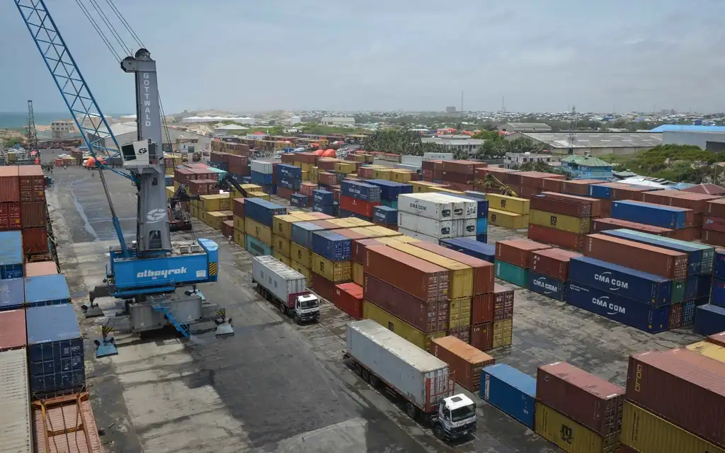 Container yard with crane and lorries