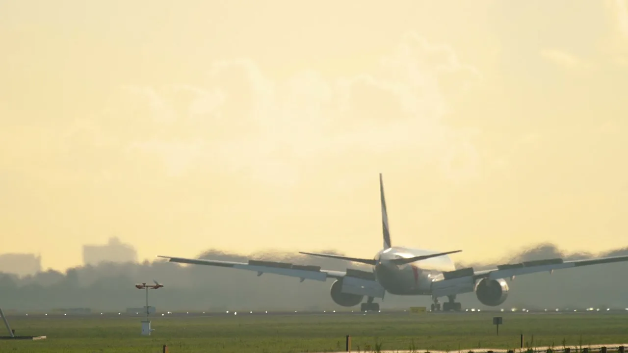 Cargo plane landing at the airport at dawn