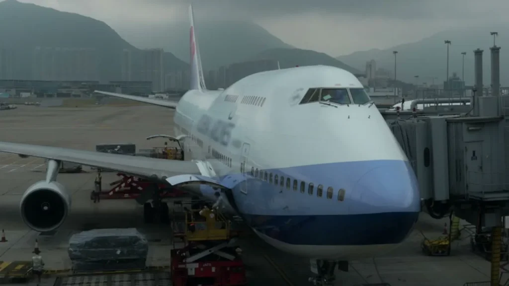 Freight being loaded onto a large plane at the airport