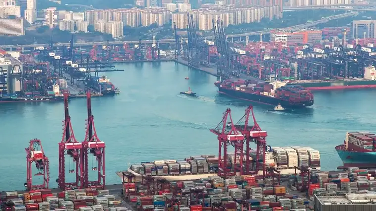 Busy container port with cranes and container vessels