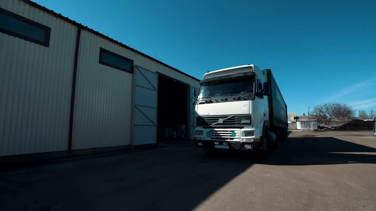 HGV lorry arriving at a warehouse loading dock