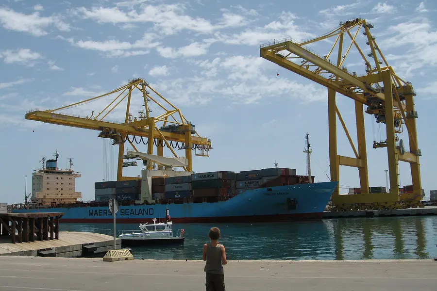 Gantry cranes loading a container ship at the Port of Algeciras, Spain